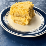 close side shot of Golden Oreo banana pudding on a plate that is showing the layers of the pudidng