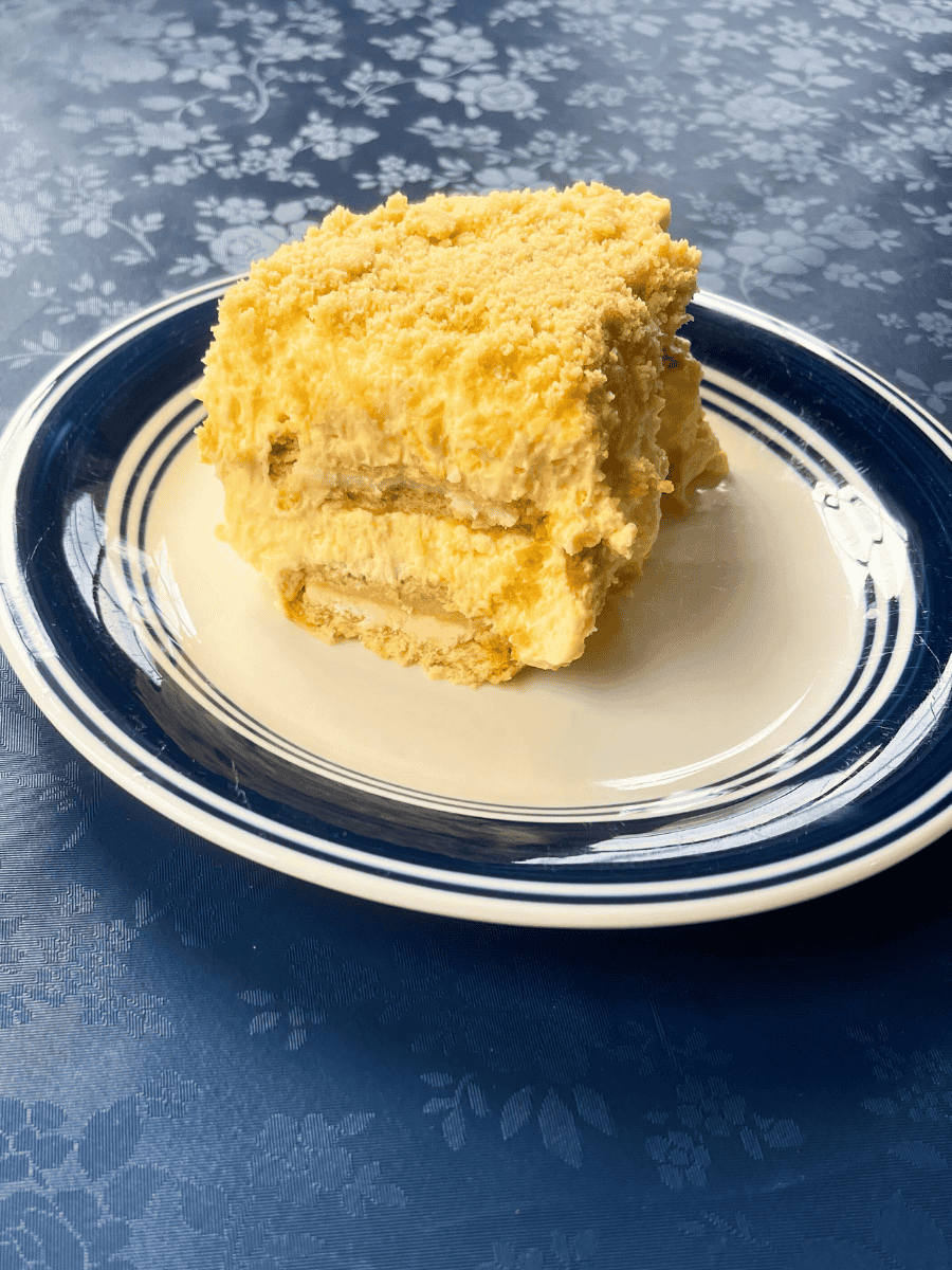 close side shot of Golden Oreo banana pudding on a plate that is showing the layers of the pudidng