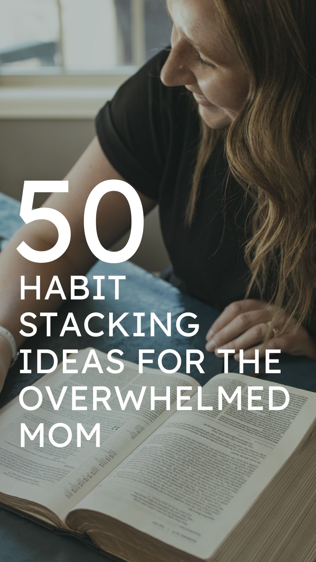 image for users to pin to pinterest to save the post that says "50 habit stacking ideas for the overwhelmed mom" with a mom in the background sitting at a kitchen table smiling and reading her bible