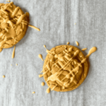 maple peanut butter cookies resting on parchment paper
