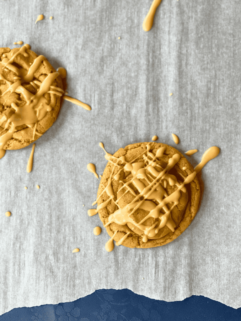 maple peanut butter cookies resting on parchment paper
