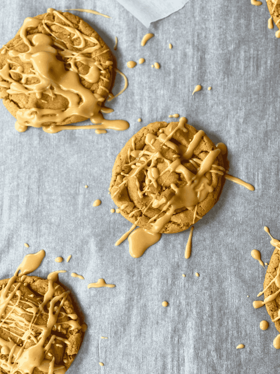maple peanut butter cookies resting on parchment paper