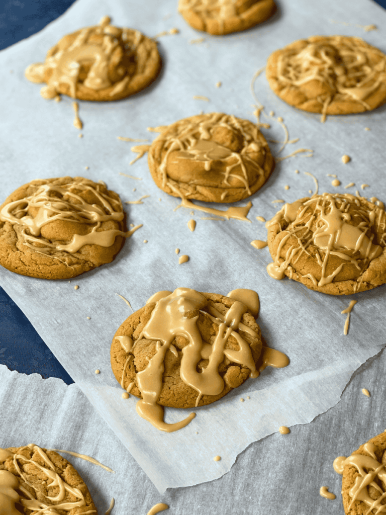 maple peanut butter cookies resting on parchment paper