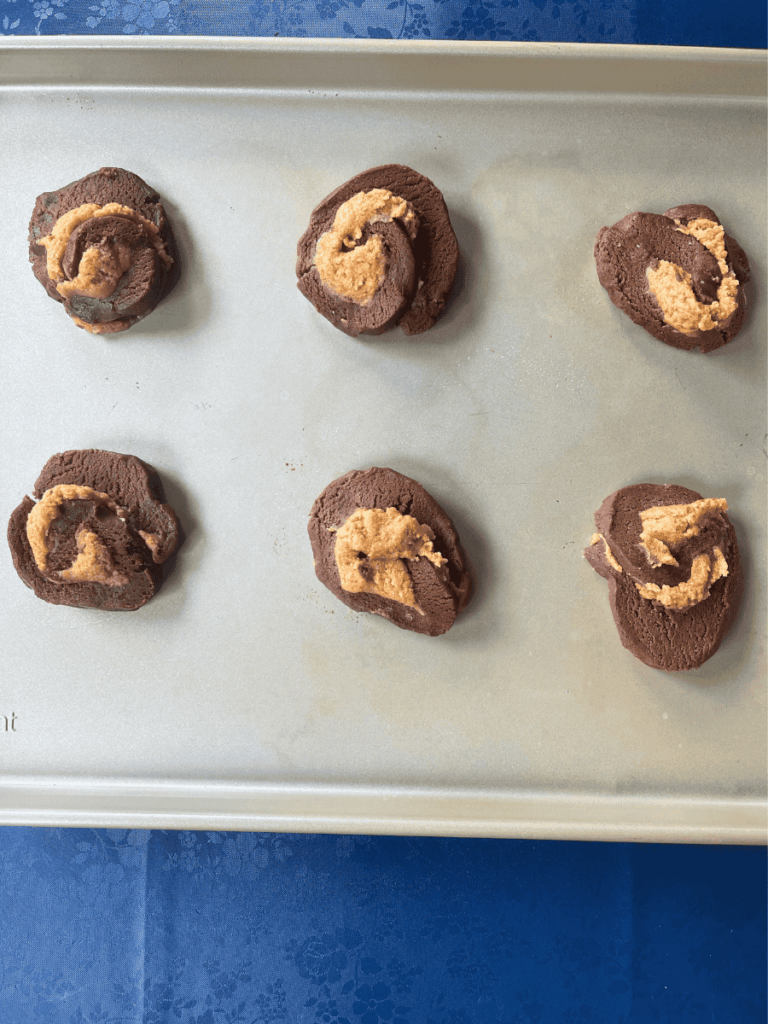 peanut butter brownie swirl cookies cut and placed on the baking sheet before baking