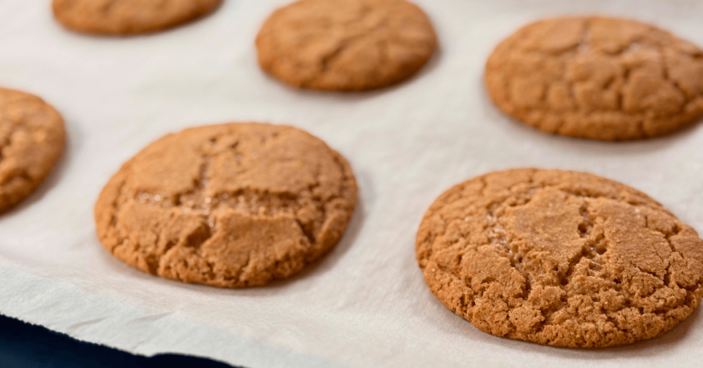 graham cookie base right after coming out of the oven and cooling on a parment lined baking tray